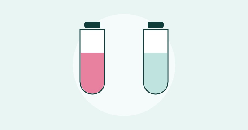 Two vials side by side, one holding a pink liquid and one holding a clear liquid.